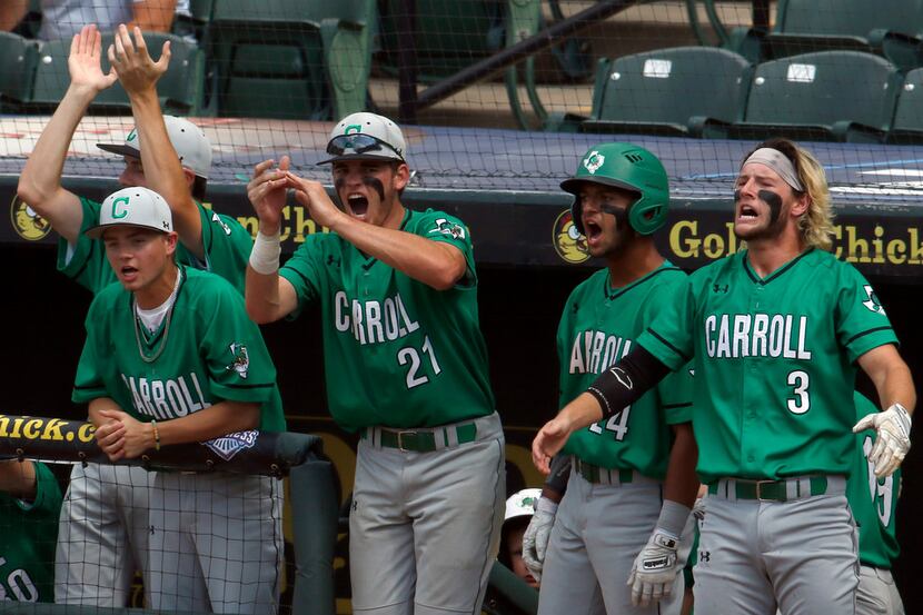 The Southlake Carroll dugout was loud and proud in support of a scoring drive in the top of...