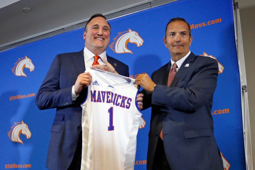 Texas-Arlington new NCAA college basketball head coach Chris Ogden, left, and athletic...
