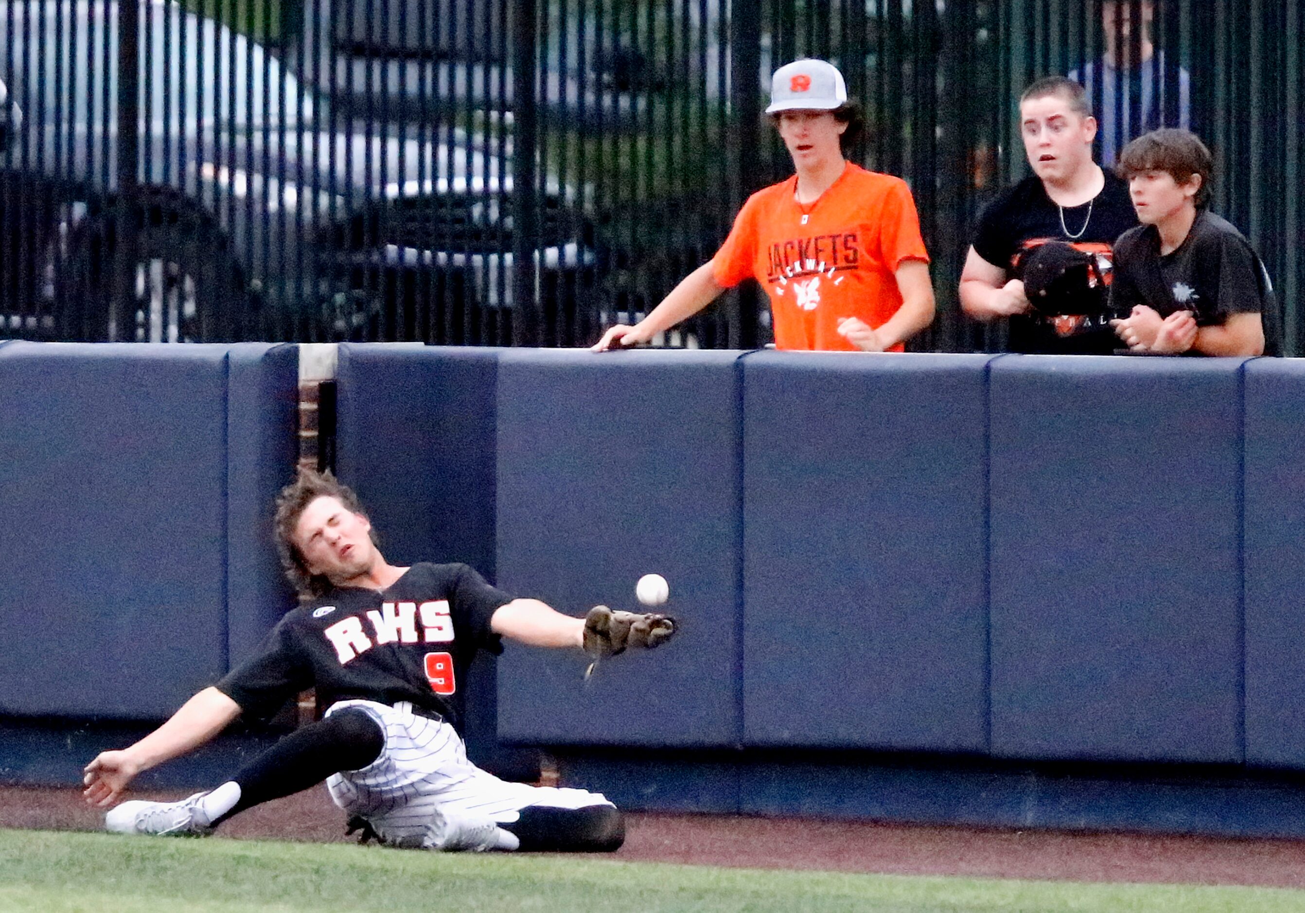 Rockwall right fielder Mason Poppen (9) was unable to hang onto this foul pop up in the...