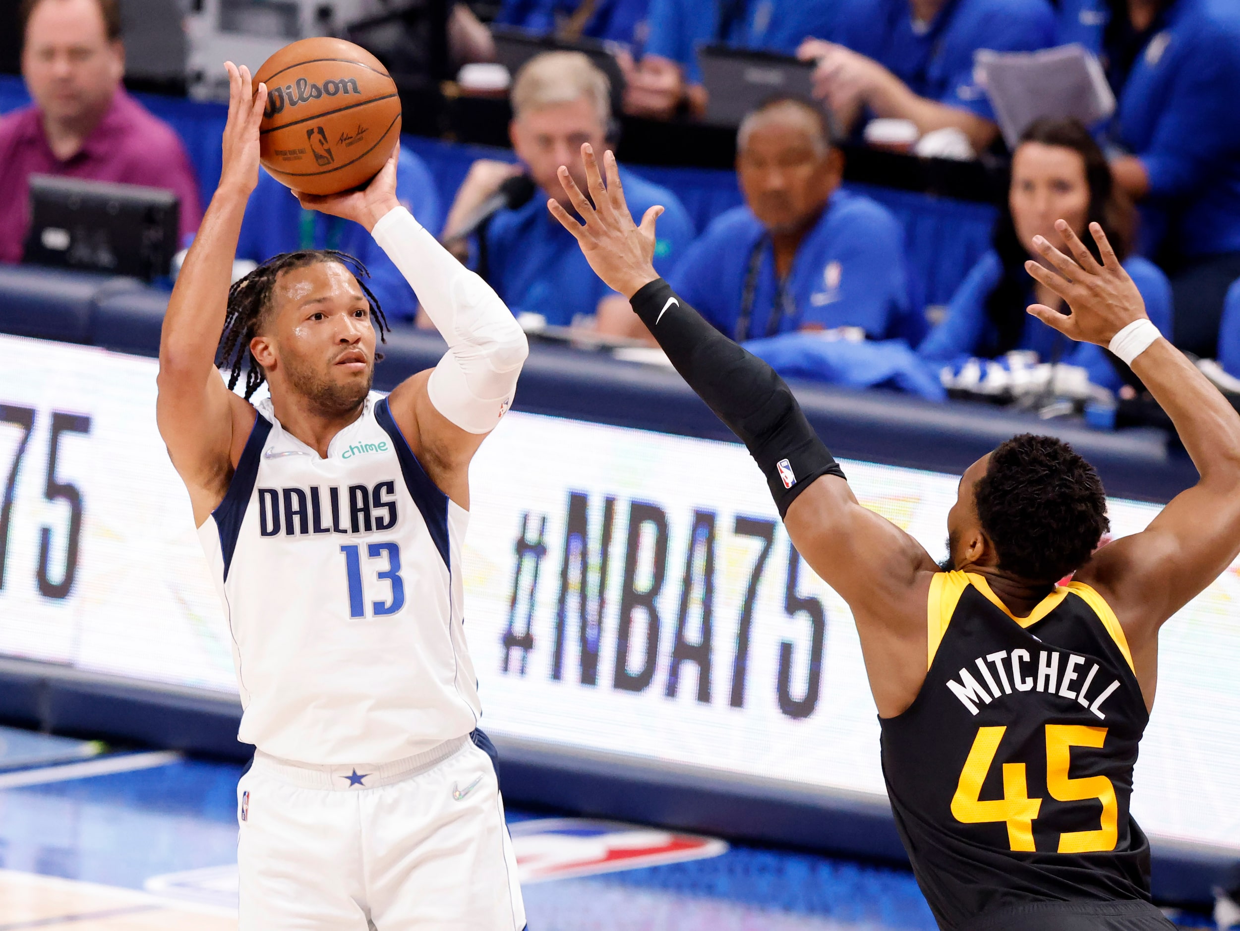 Dallas Mavericks guard Jalen Brunson (13) nails a there-pointer early in the first quarter...