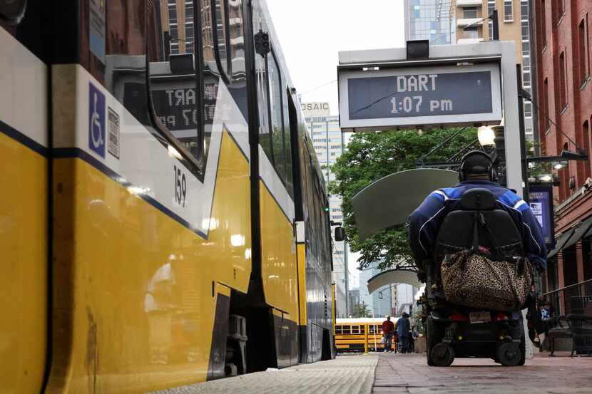 A man waits to board a DART light rail at West End station on Thursday, May 5, 2022 in...