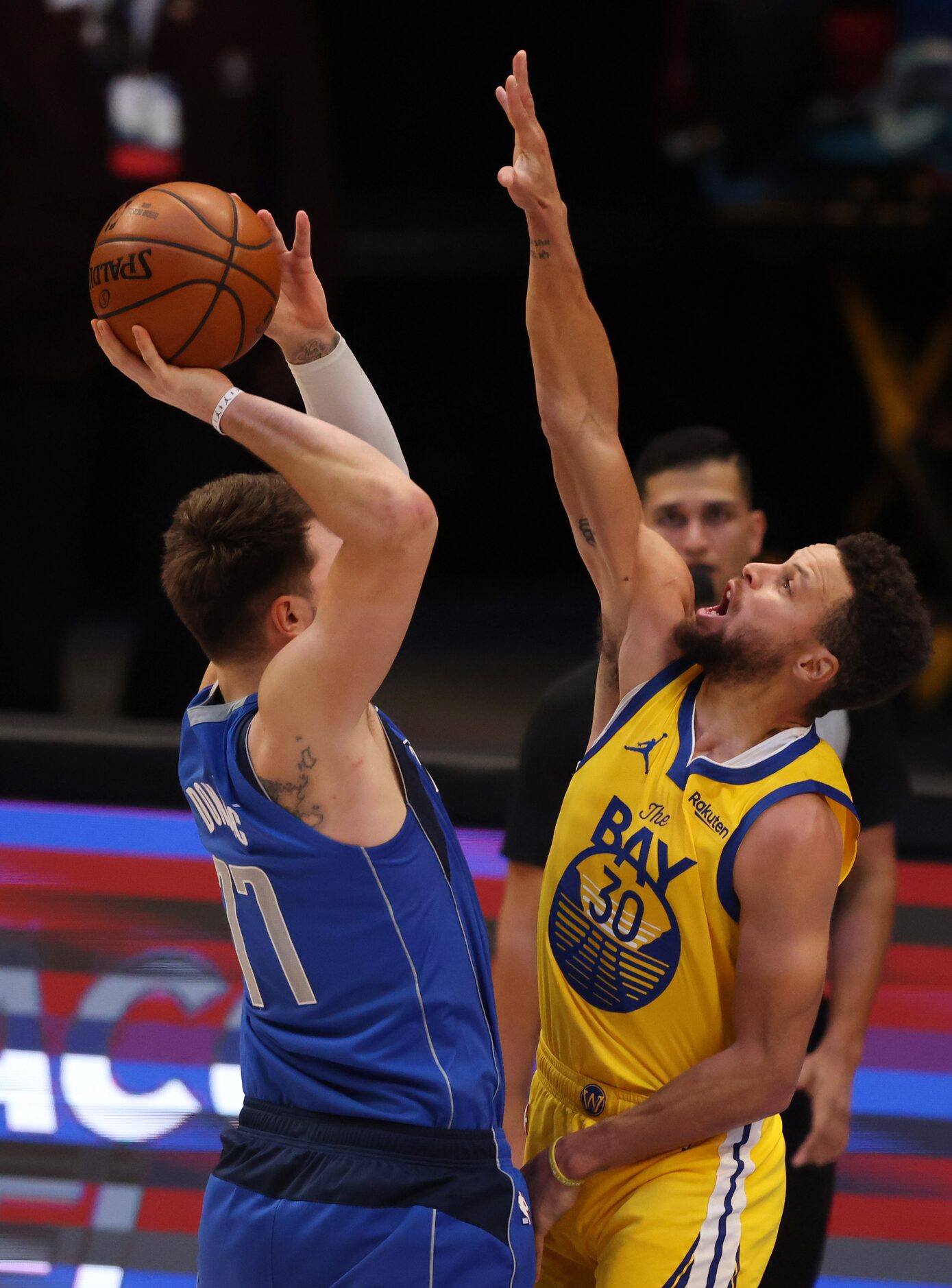 Dallas Mavericks guard Luka Doncic (77) rises up before passing away as Golden State...