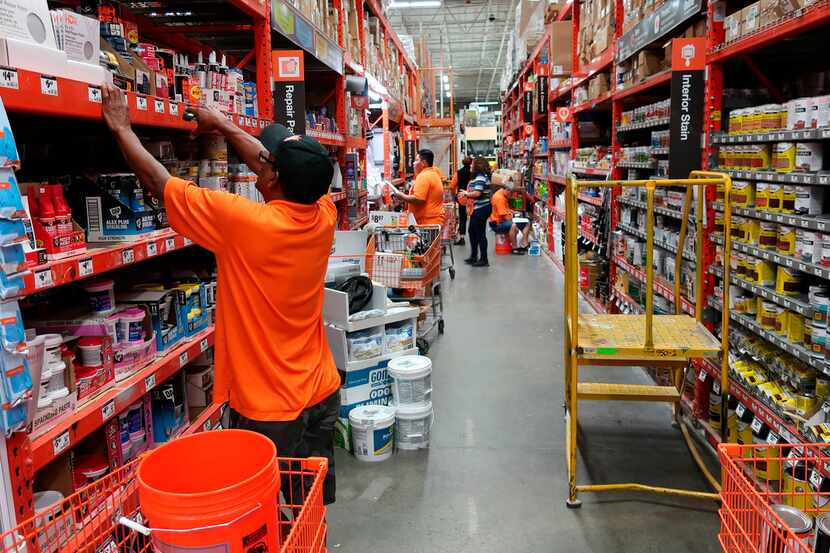 Workers stock the shelves at a Home Depot store in New Jersey.