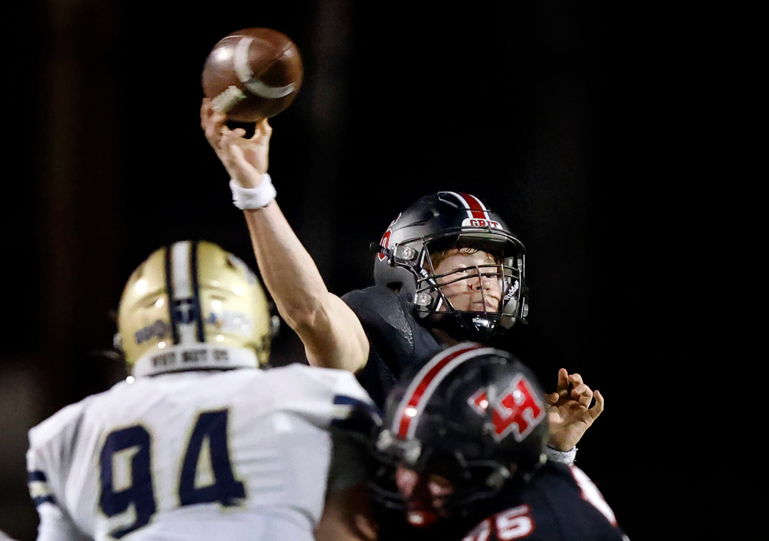 Lake Highlands High quarterback Harrison Day (6) throws a second half pass against Jesuit...