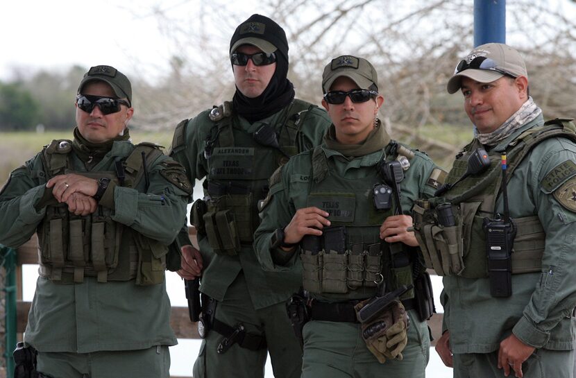 Members of the Texas Department of Public Safety listen to U.S. Rep. Michael McCaul,...