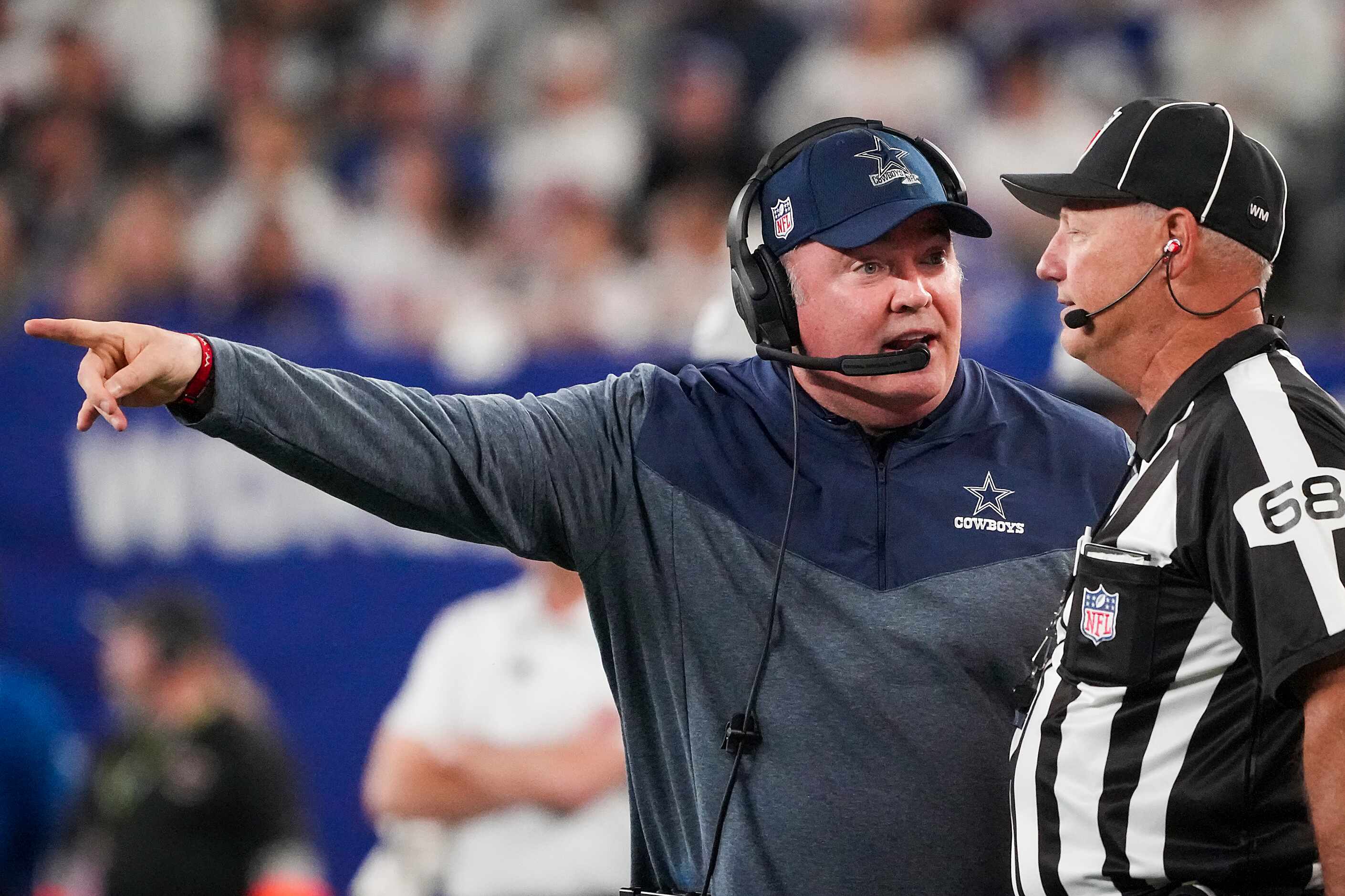 Dallas Cowboys head coach Mike McCarthy argues for a call with down judge Tom Stephan during...