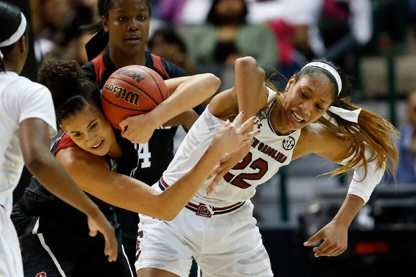 Stanford Cardinal forward Kaylee Johnson (5) takes possession of a loose ball in front of...