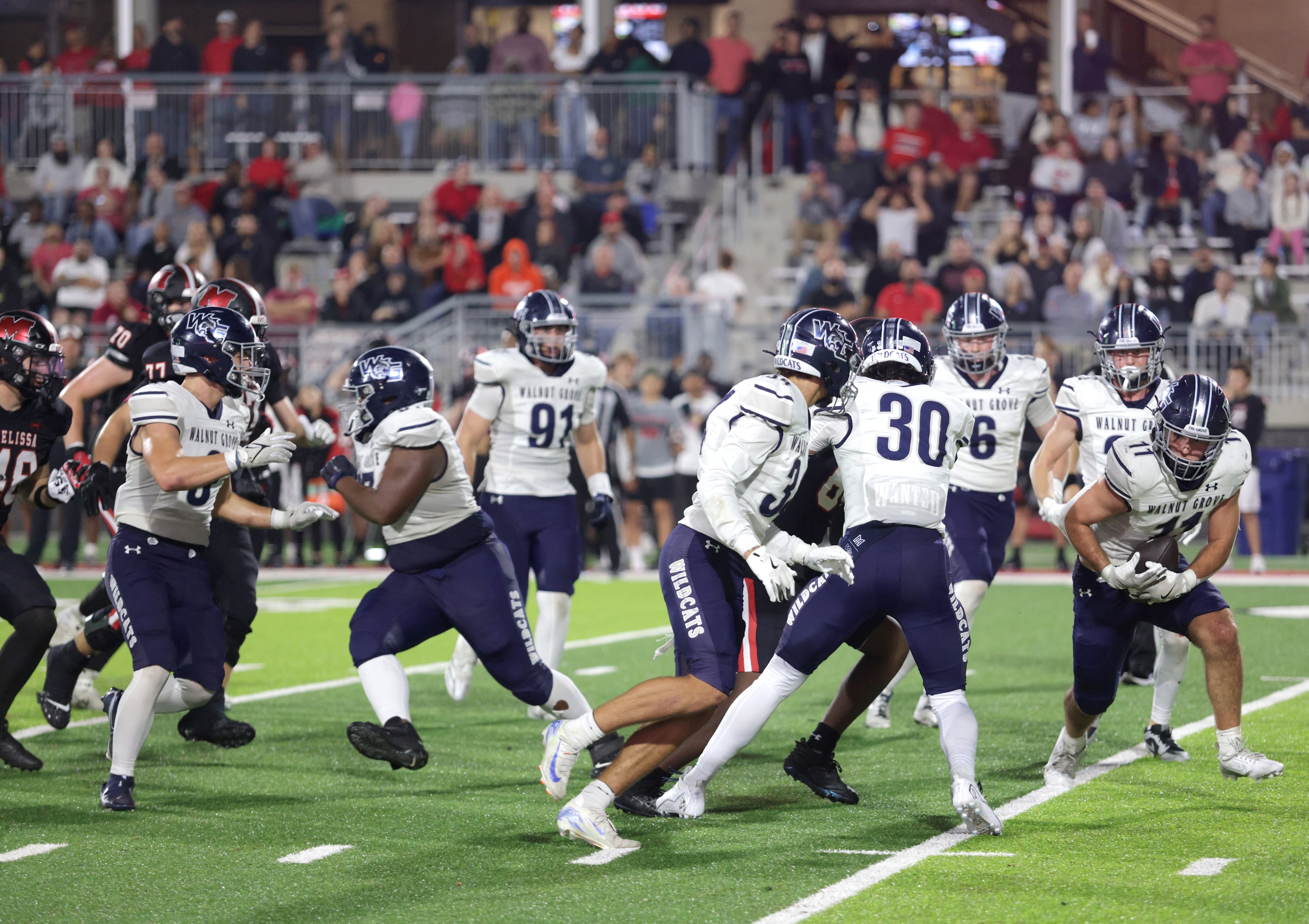 Walnut Grove player #11 Keller Pittenger recovers the ball after a blocked kick during the...