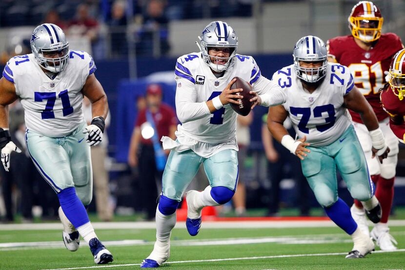Dallas Cowboys quarterback Dak Prescott (4) races to the goal line for a fourth quarter...