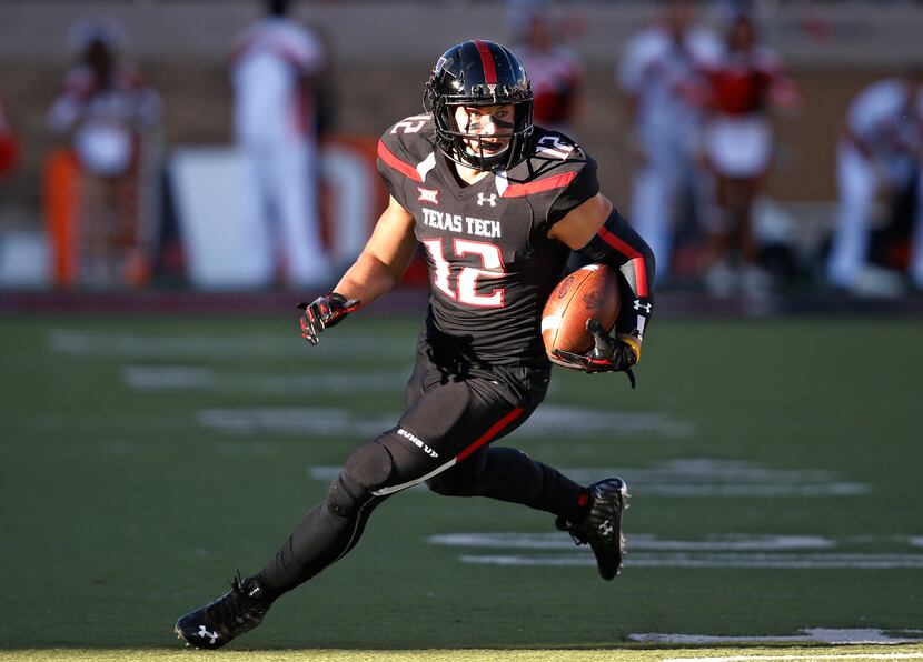 FILE - In this Oct. 31, 2015, file photo, Texas Tech wide receiver Ian Sadler carries the...