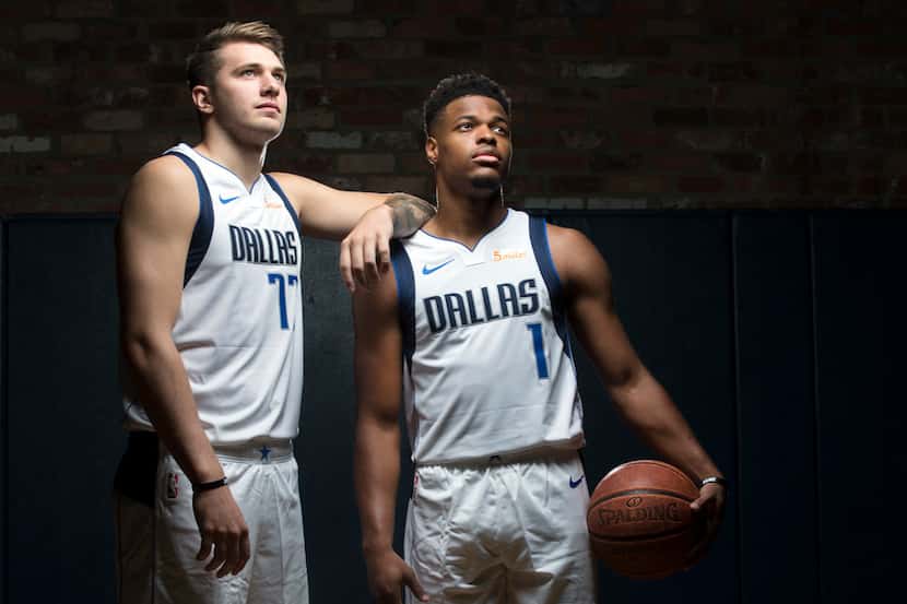 Dallas Mavericks guard Luka Doncic (left) and guard Dennis Smith Jr. pose for a photo during...