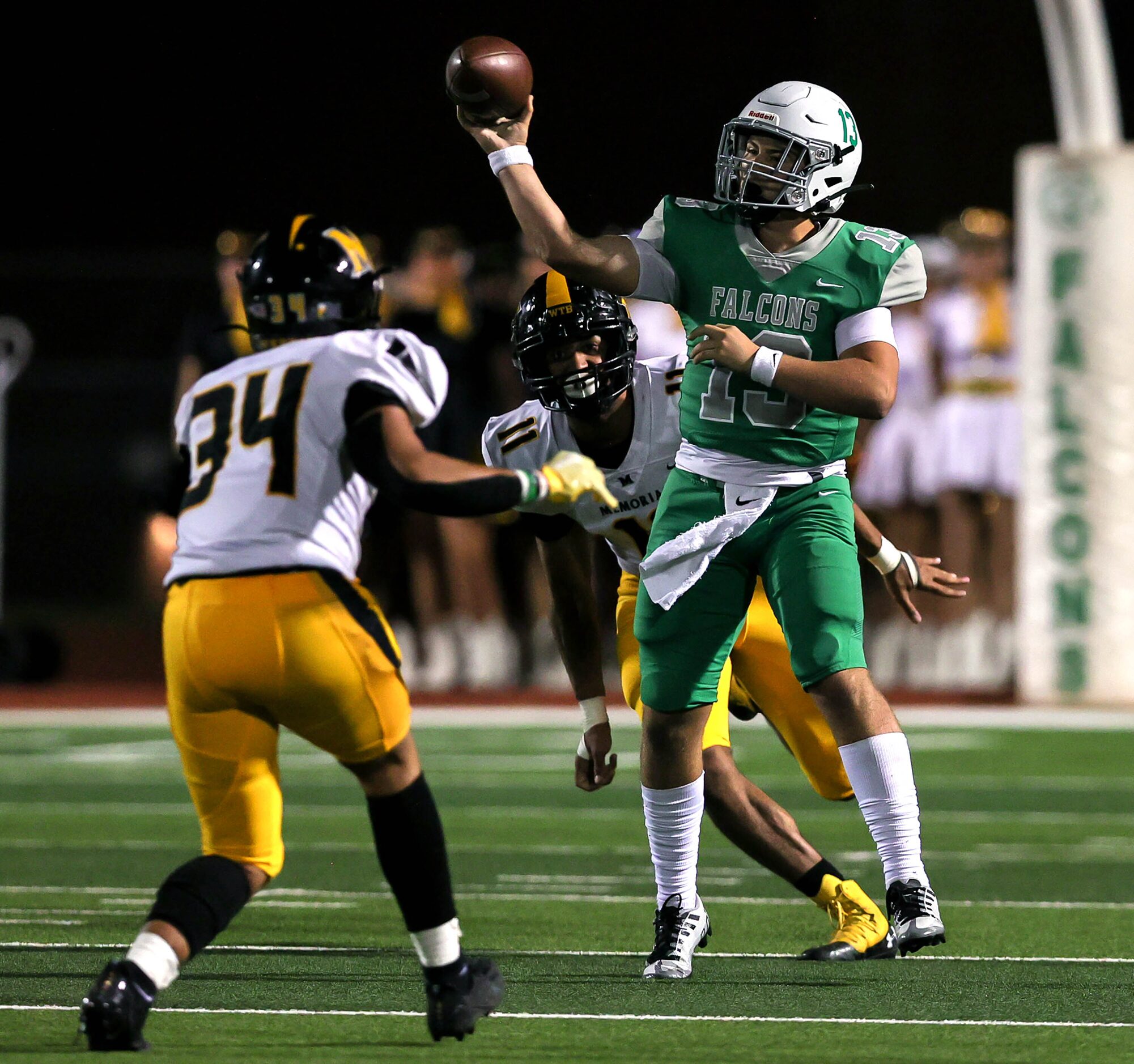 Lake Dallas quarterback Cade Bortnem (13) gets some pressure from Frisco Memorial linebacker...