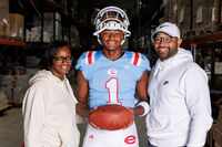 15-year-old Peyton Houston (center) stands with his parents Naomi and Shaun Houston at Leaf...