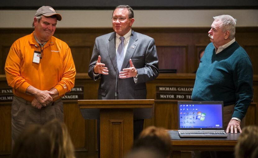 Rowlett Mayor Todd Gottel honors Rowlett residents Sammy Walker (left) and Bruce Hargrave...