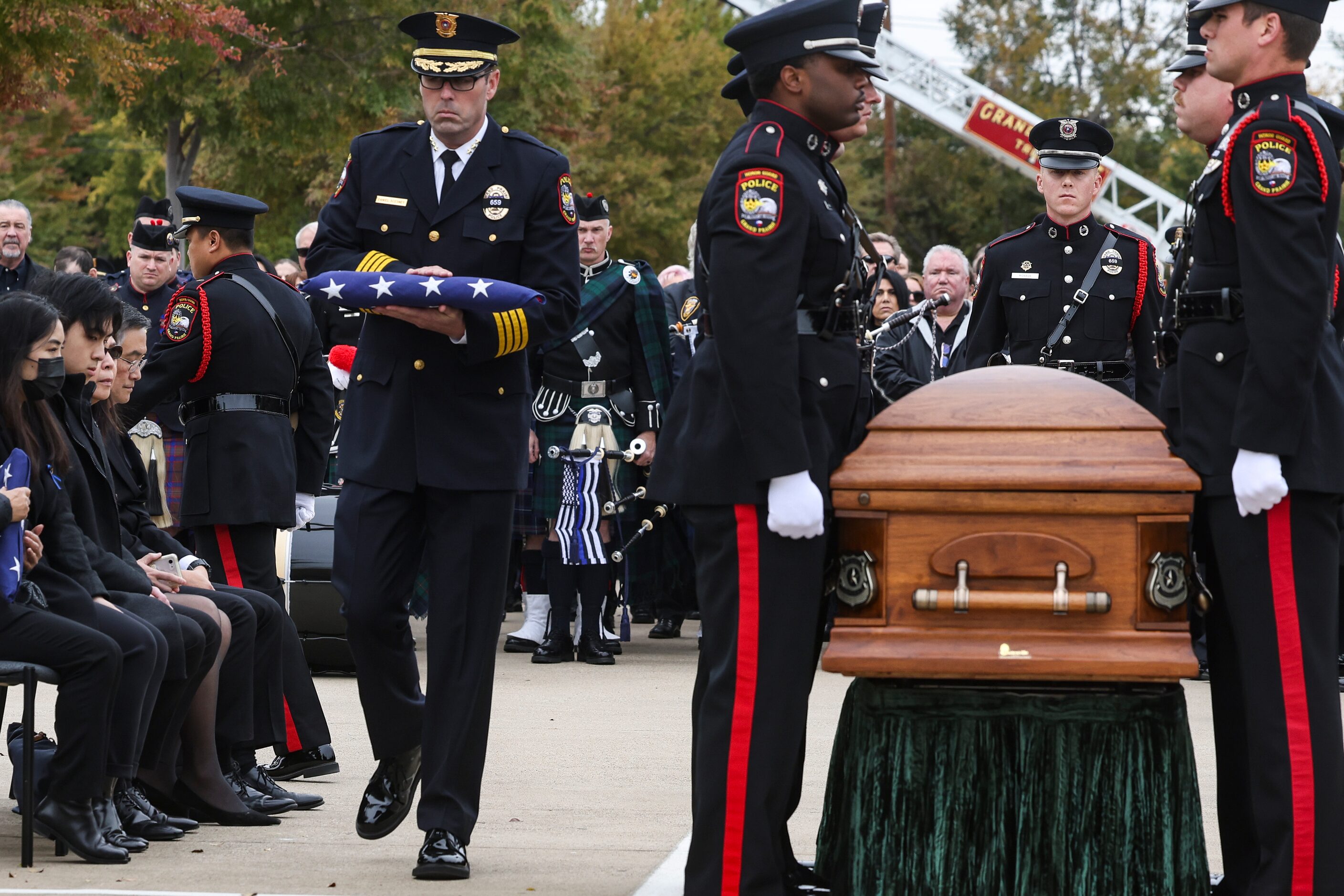 Daniel Scesney, Chief of Police at Grand Prairie Police Department, holds an American flag...