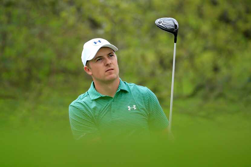 Jordan Spieth of the United States hits his tee shot on the 12th hole during the round of 16...