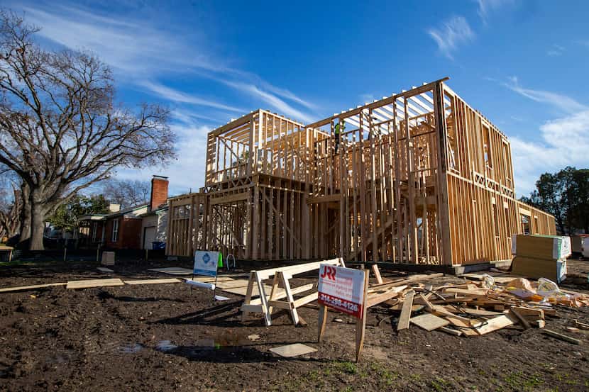 Workers constructed a two-story house in the Elm Thicket-Northpark neighborhood in North...