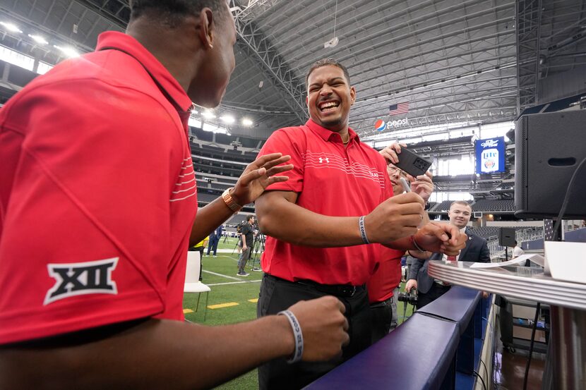 Texas Tech offensive lineman Caleb Rogers, right, laughs with teammate defensive back...