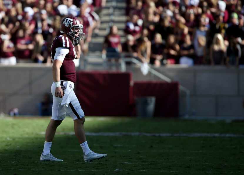 Texas A&M Aggies quarterback Kyle Allen (10) walks off the field during a break in play in...