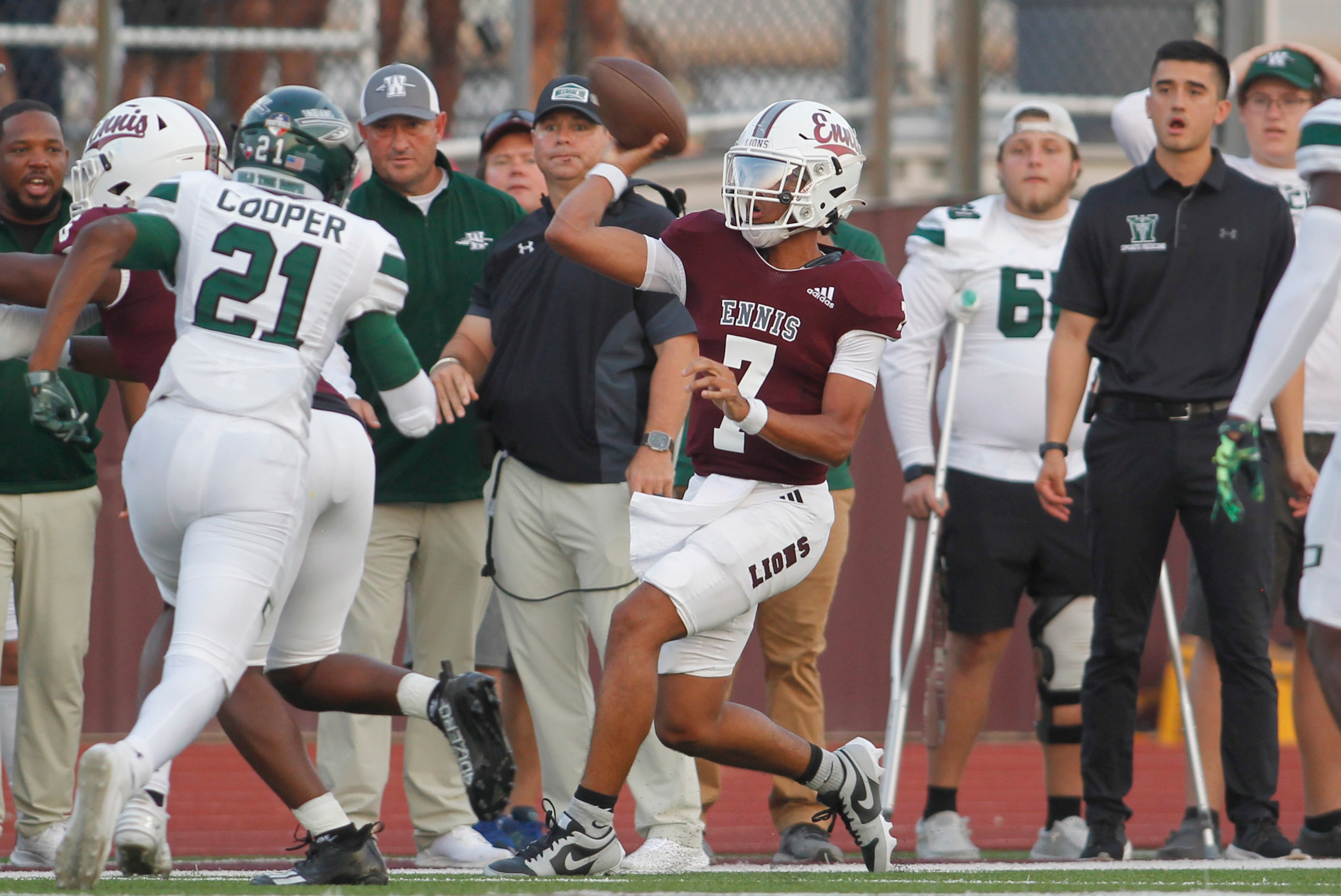 Ennis quarterback Wondame davis Jr. (7) passes over the defense of Waxahachie linebacker...