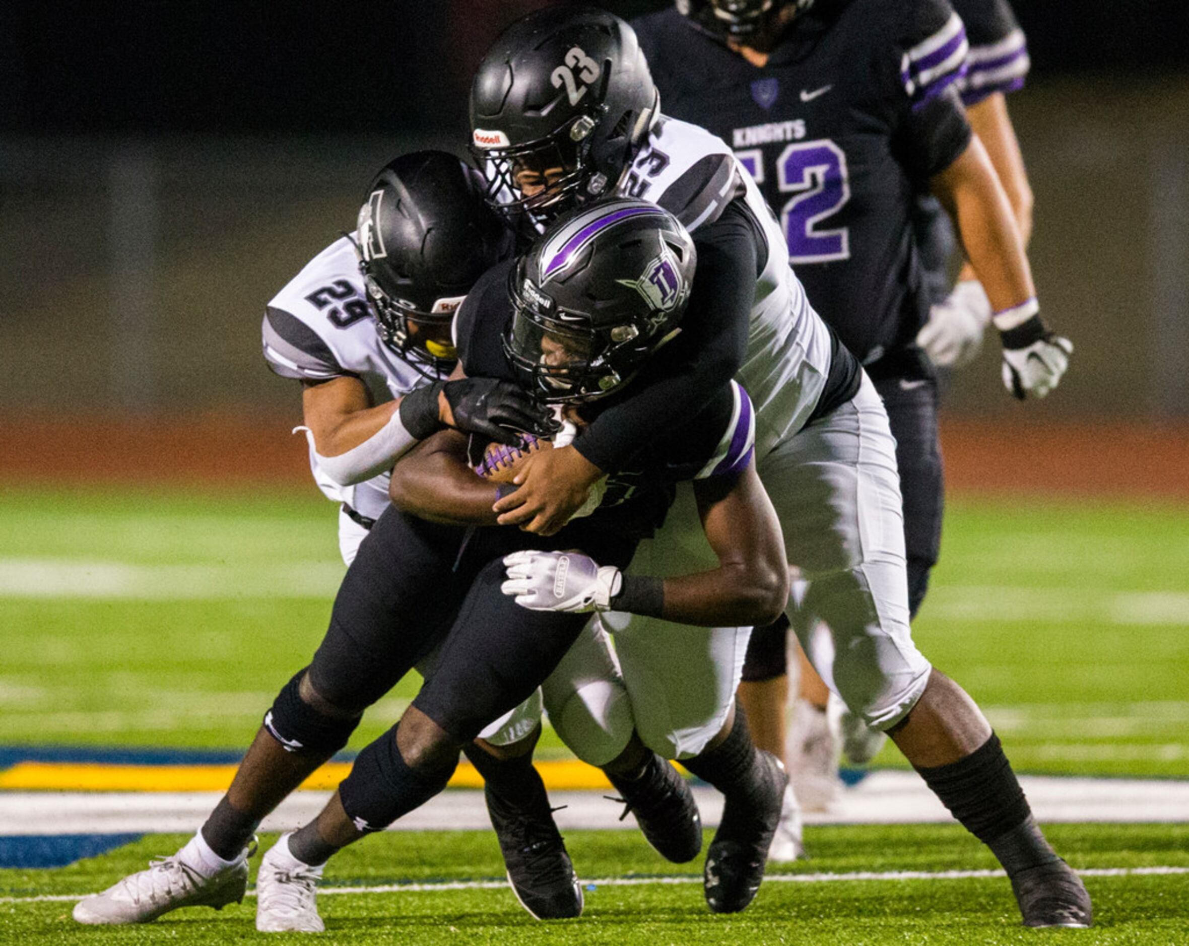 Frisco Independence running back Dwayne Orr (10) is tackled by Mansfield Timberview...