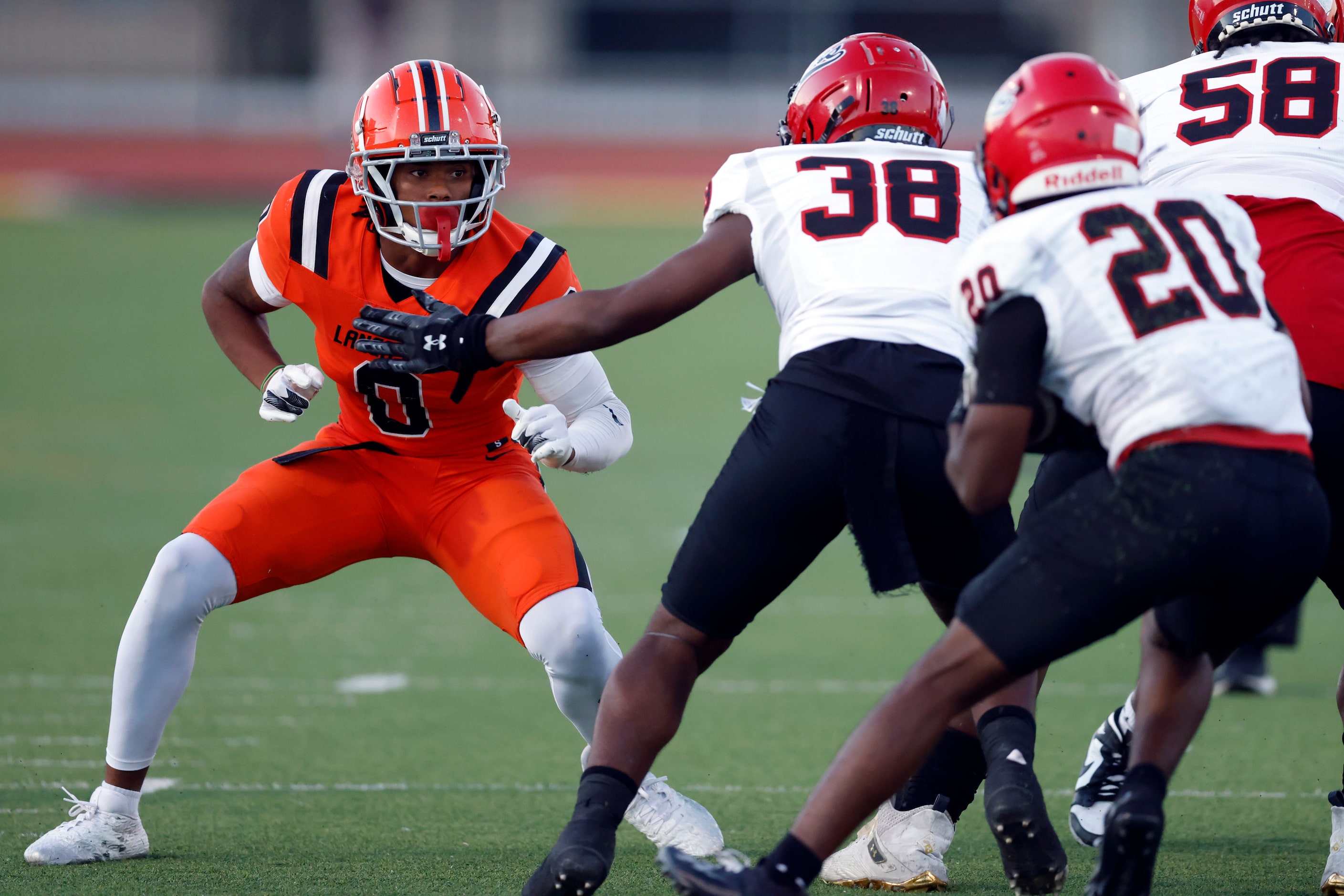 Lancaster linebacker Ke’Breion Winston (0) looks to tackle Cedar Hill running back CJ...