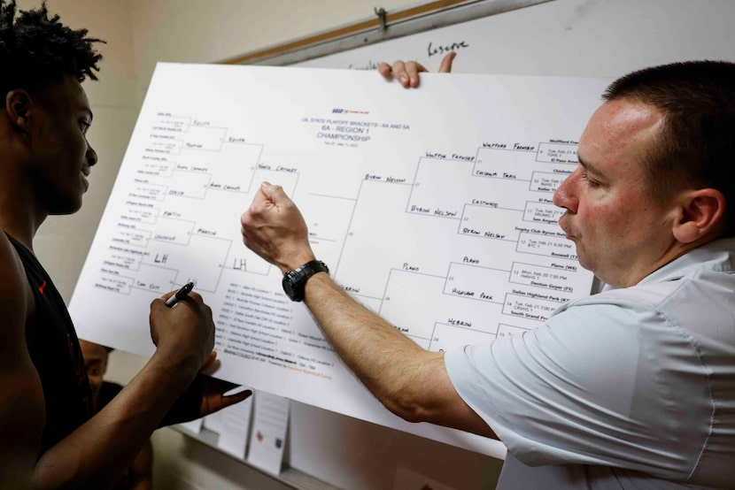 Lake Highlands high forward Jaire Williams (left), is welcomed by head coach Joe Duffield to...