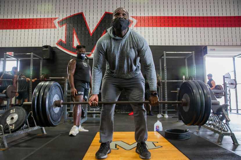 Homicide Sergeant Brian Jones from the Arlington Police Department works out with Arlington...