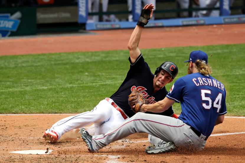 Cleveland Indians' Bradley Zimmer slides safely into home plate as Texas Rangers starting...