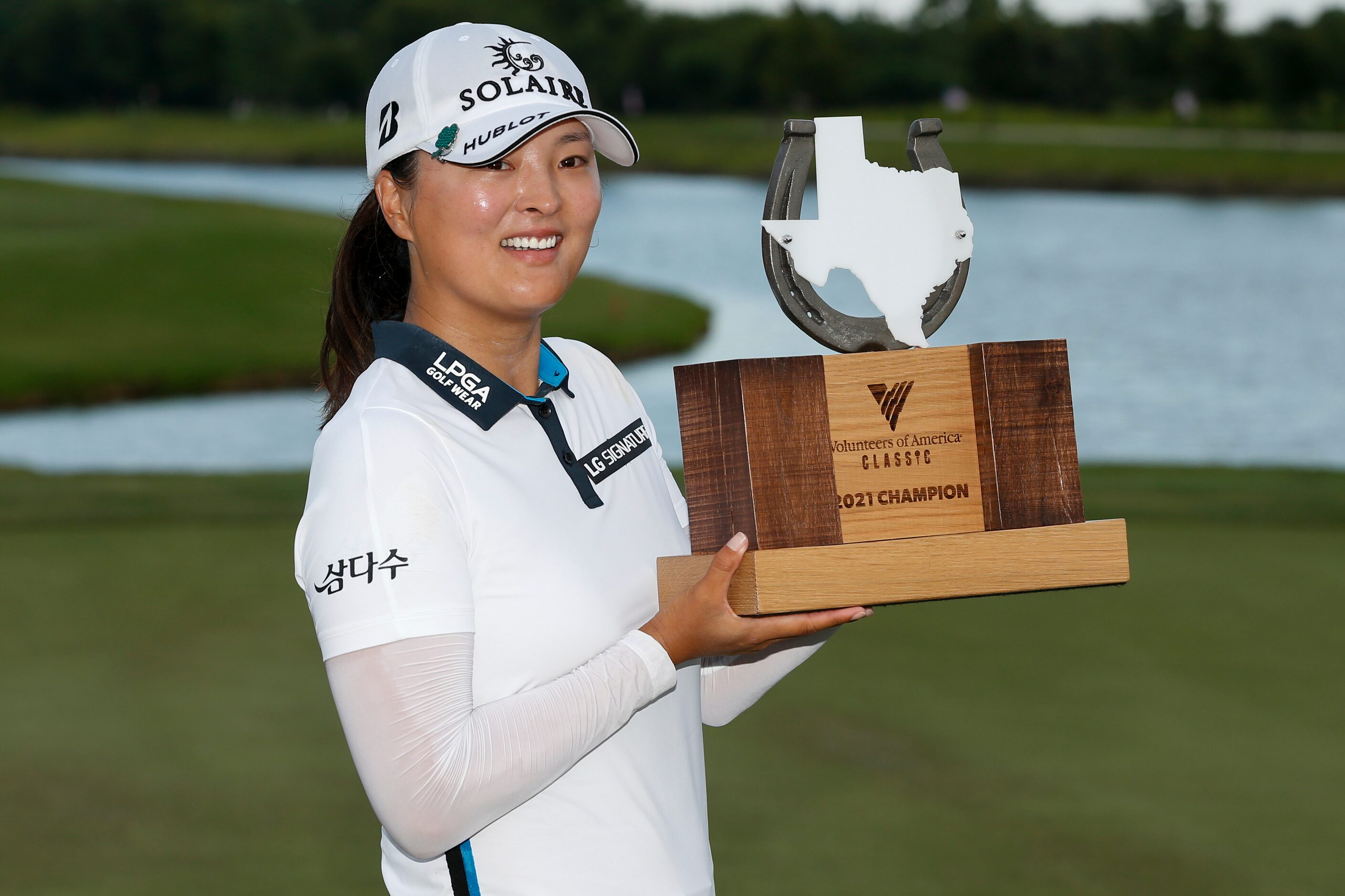 Professional golfer Jin Young Ko lifts the winner’s trophy after winning the LPGA VOA...