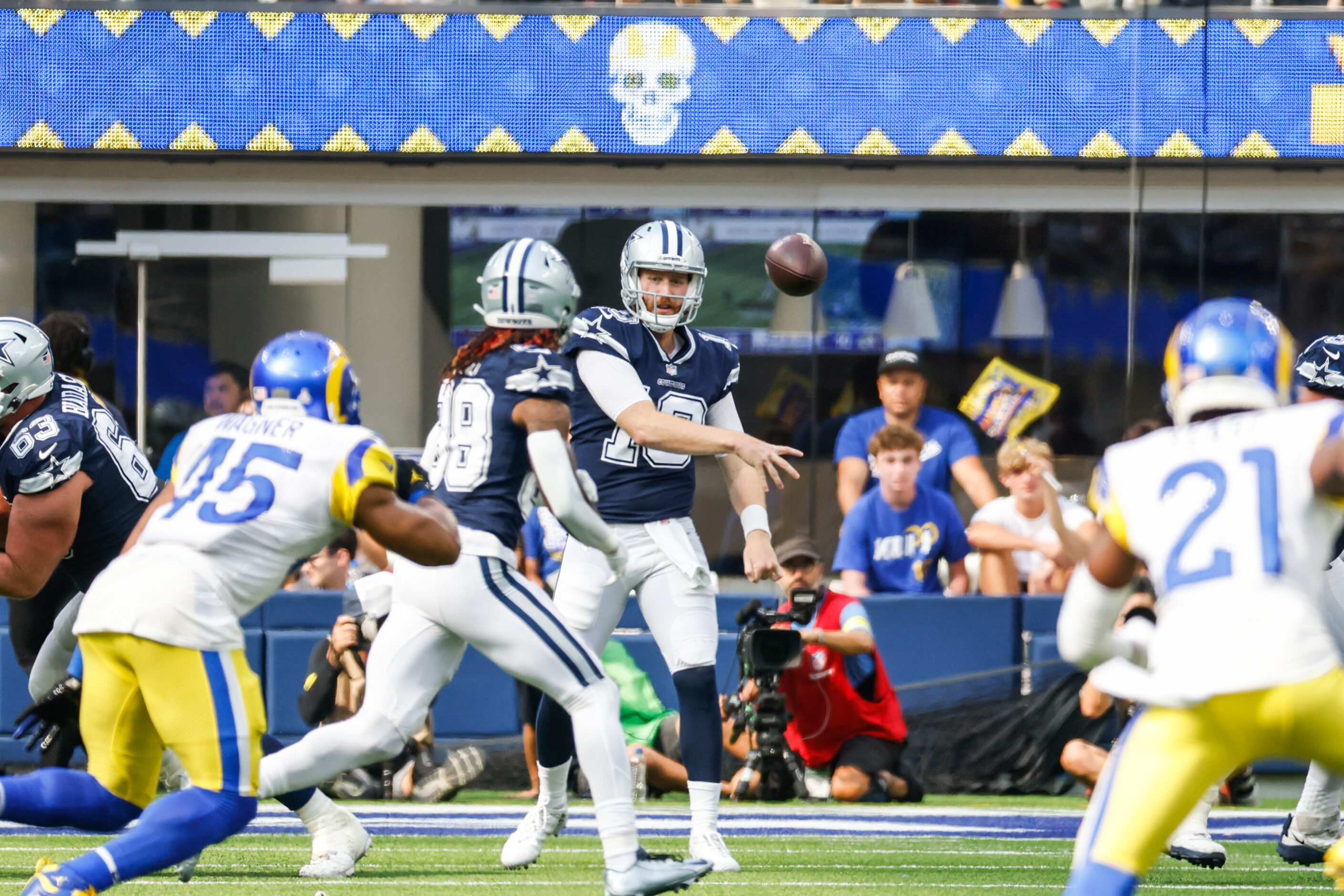 Dallas Cowboys quarterback Cooper Rush (10) makes a pass to wide receiver CeeDee Lamb (88)...