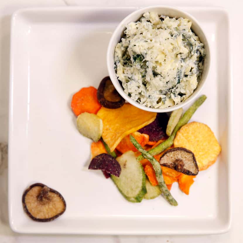 Houston's restaurant-style spinach and artichoke dip can be served with vegetable chips.