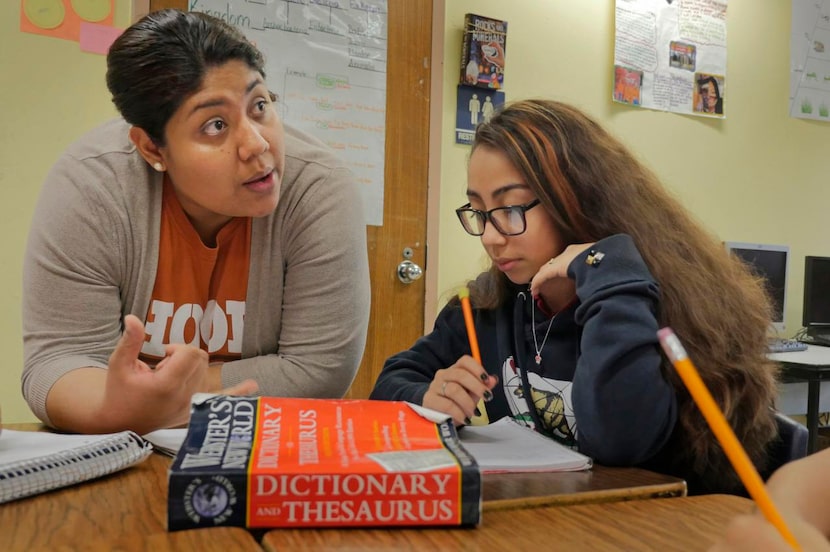 
Maria Martinez (left) asks Tiffany Canelo and others about force in her sixth-grade science...