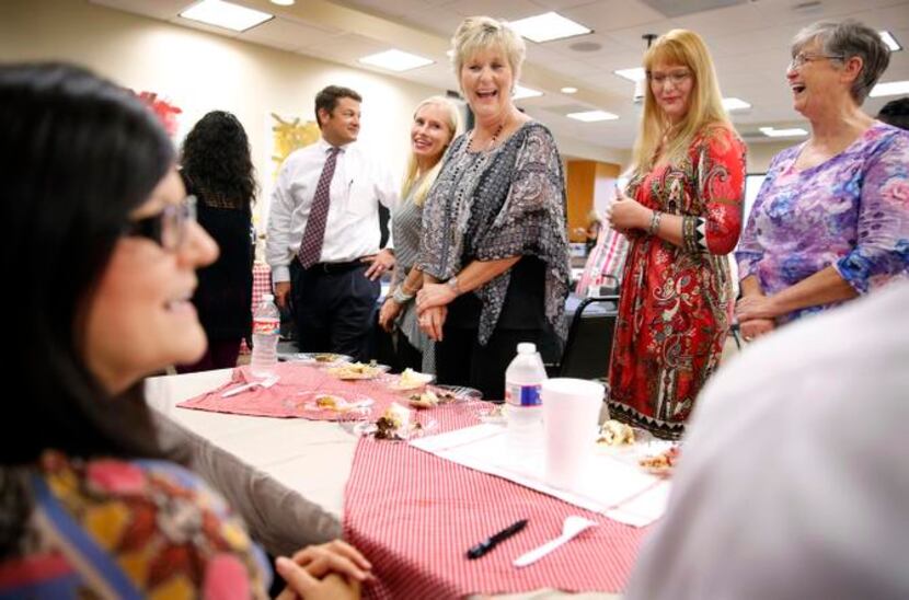 
Trisha Weaver (left) got the plum job of judging the pie contest at the Uptown office of...