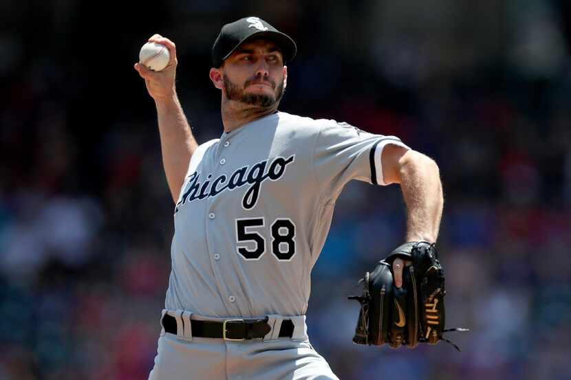 ARLINGTON, TX - AUGUST 20:  Miguel Gonzalez #58 of the Chicago White Sox pitches against the...
