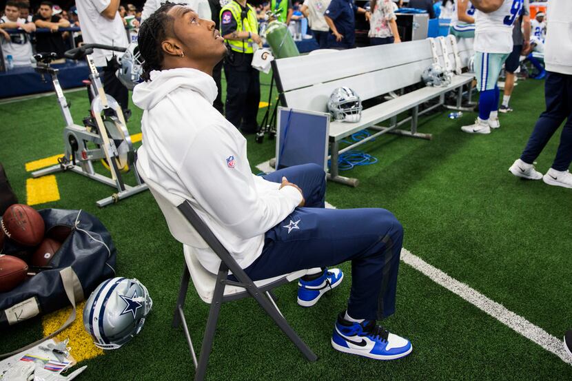 Dallas Cowboys defensive end Taco Charlton (97) sits on the sideline during the first...