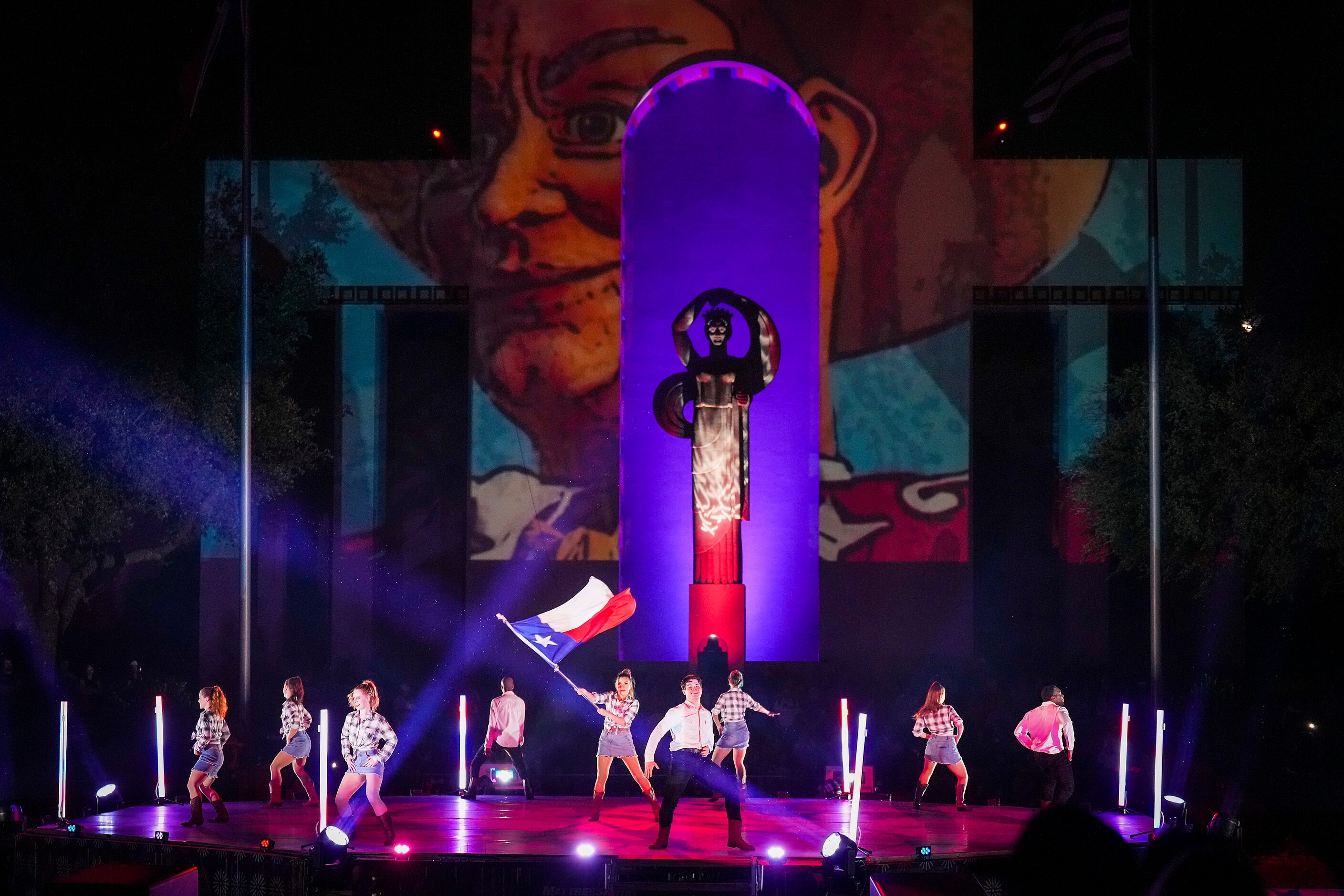 Dancers perform during the Mattress Firm Illumination Sensation on opening day at the State...