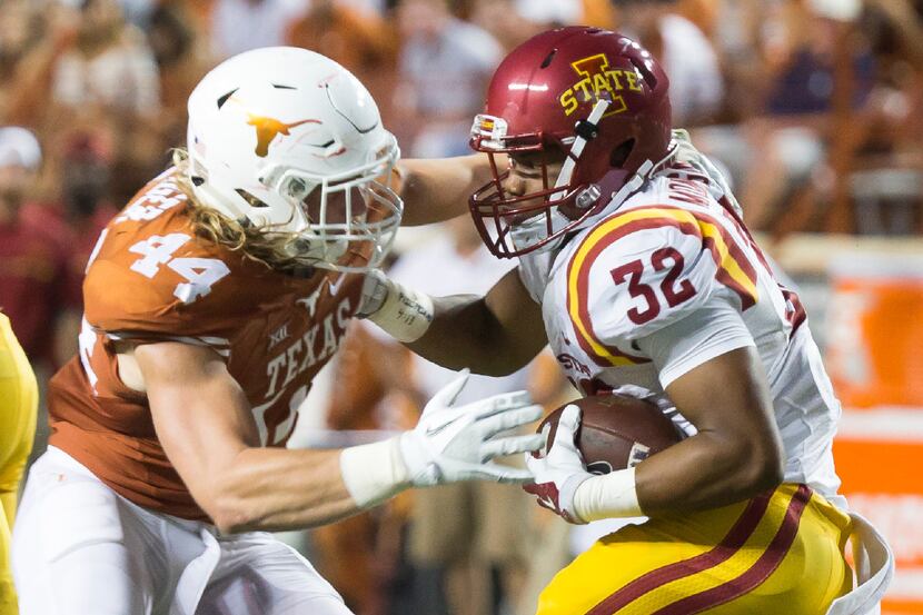Texas' Breckyn Hager (44) tries to bring down Iowa State running back David Montgomery (32)...