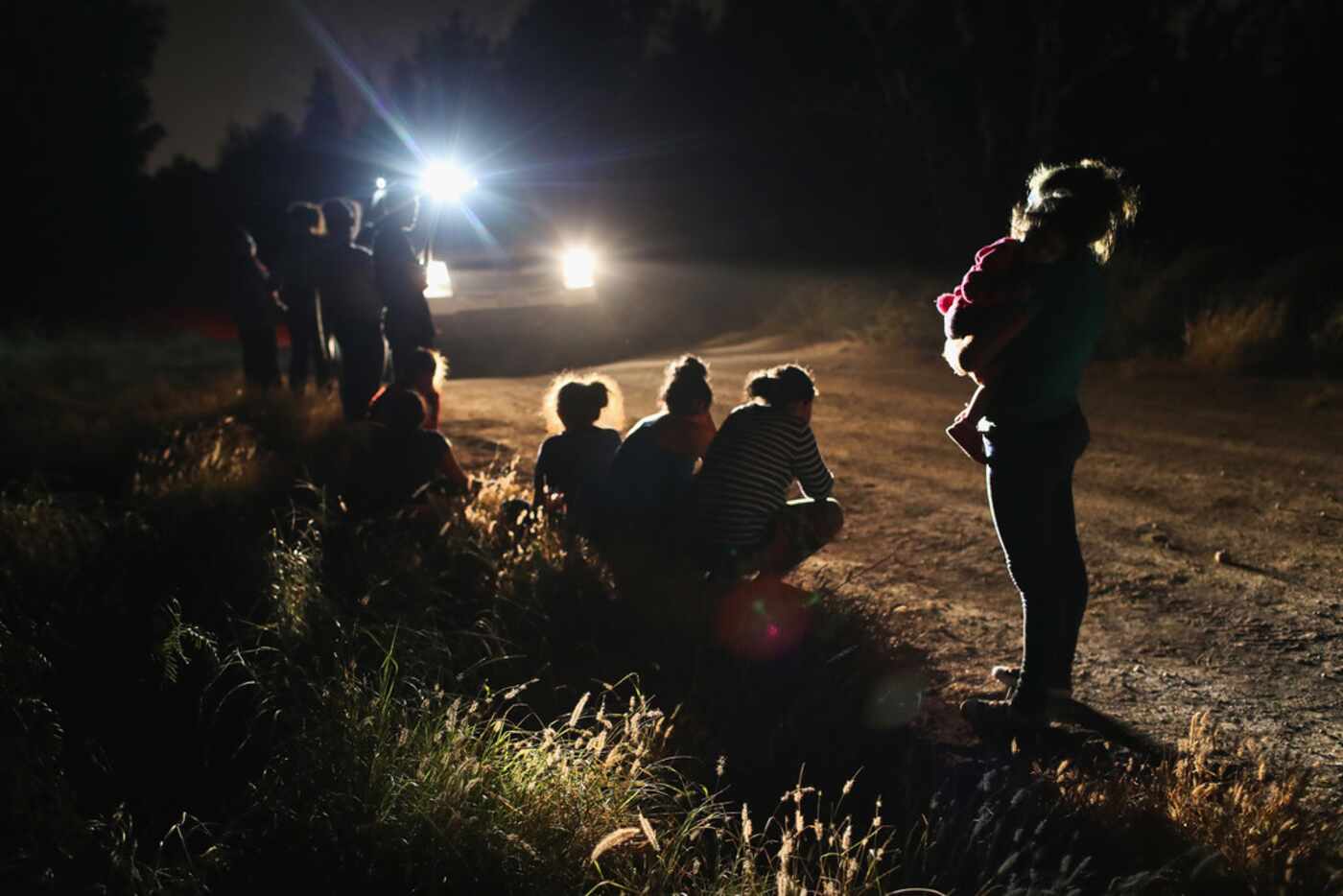U.S. Border Patrol agents arrive to detain a group of Central American asylum seekers near...