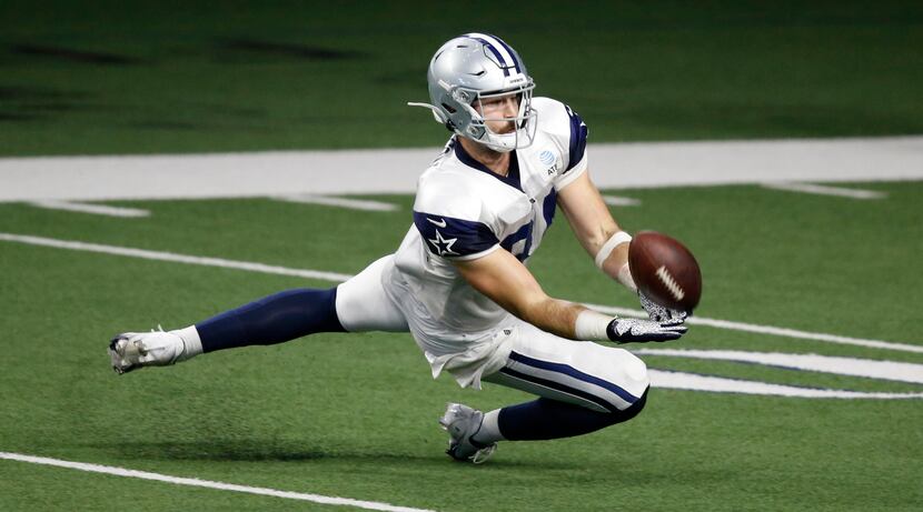 Dallas Cowboys tight end Sean McKeon (84) prepares to catch a pass on a play during training...