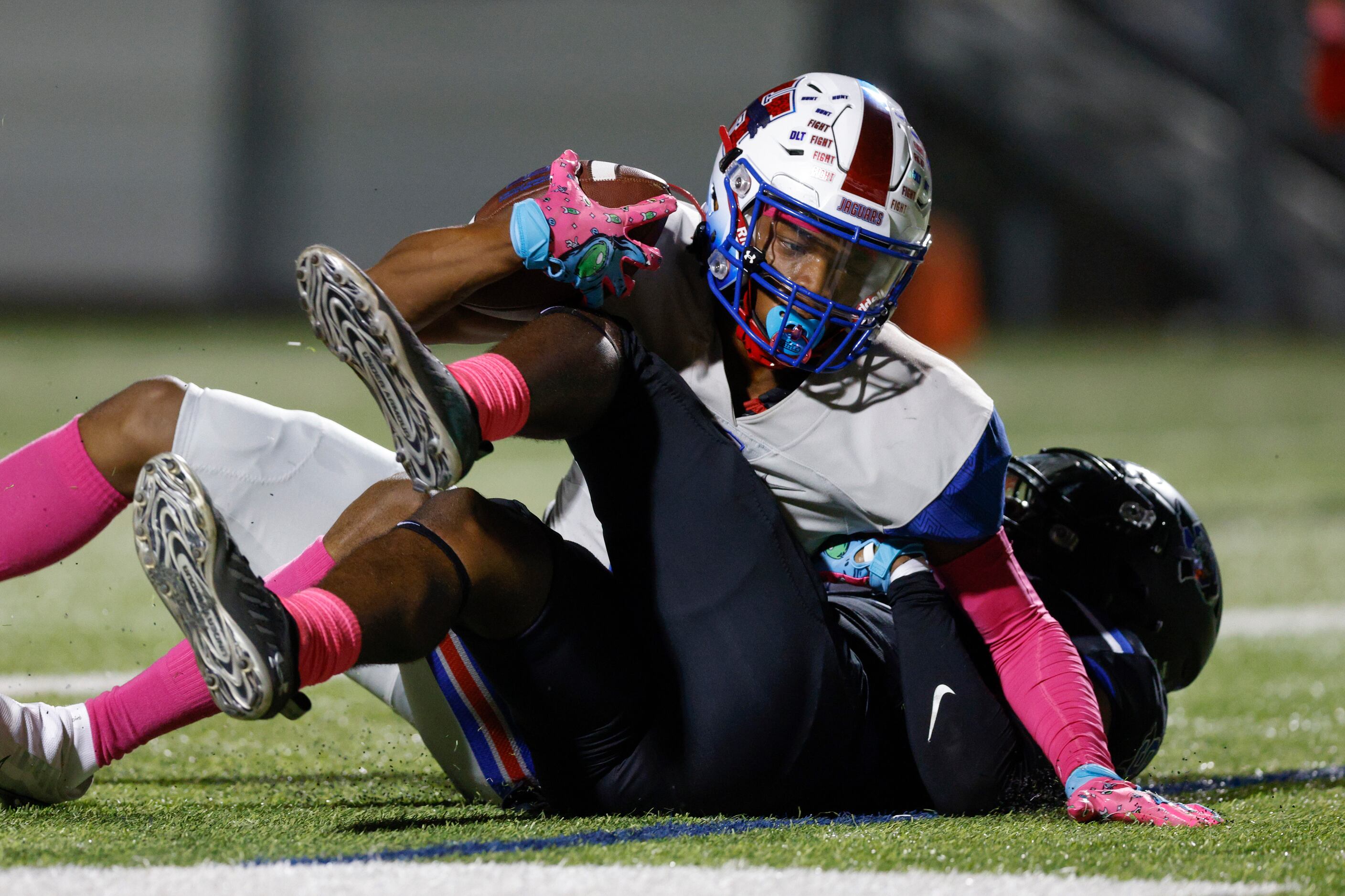 Midlothian Heritage wide receiver Xavier Moten (11) falls into the end zone for a touchdown...