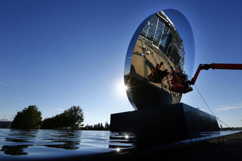 The new "Sky Mirror" sculpture by Anish Kapoor received a final polish last week prior to...