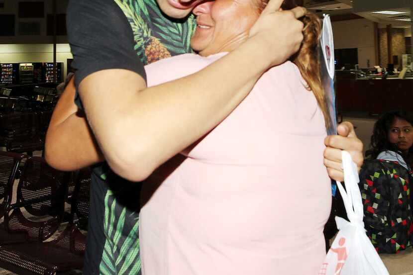 Francisco Galicia embraces his mother Sanjuana Galicia at the McAllen, Texas, Central...