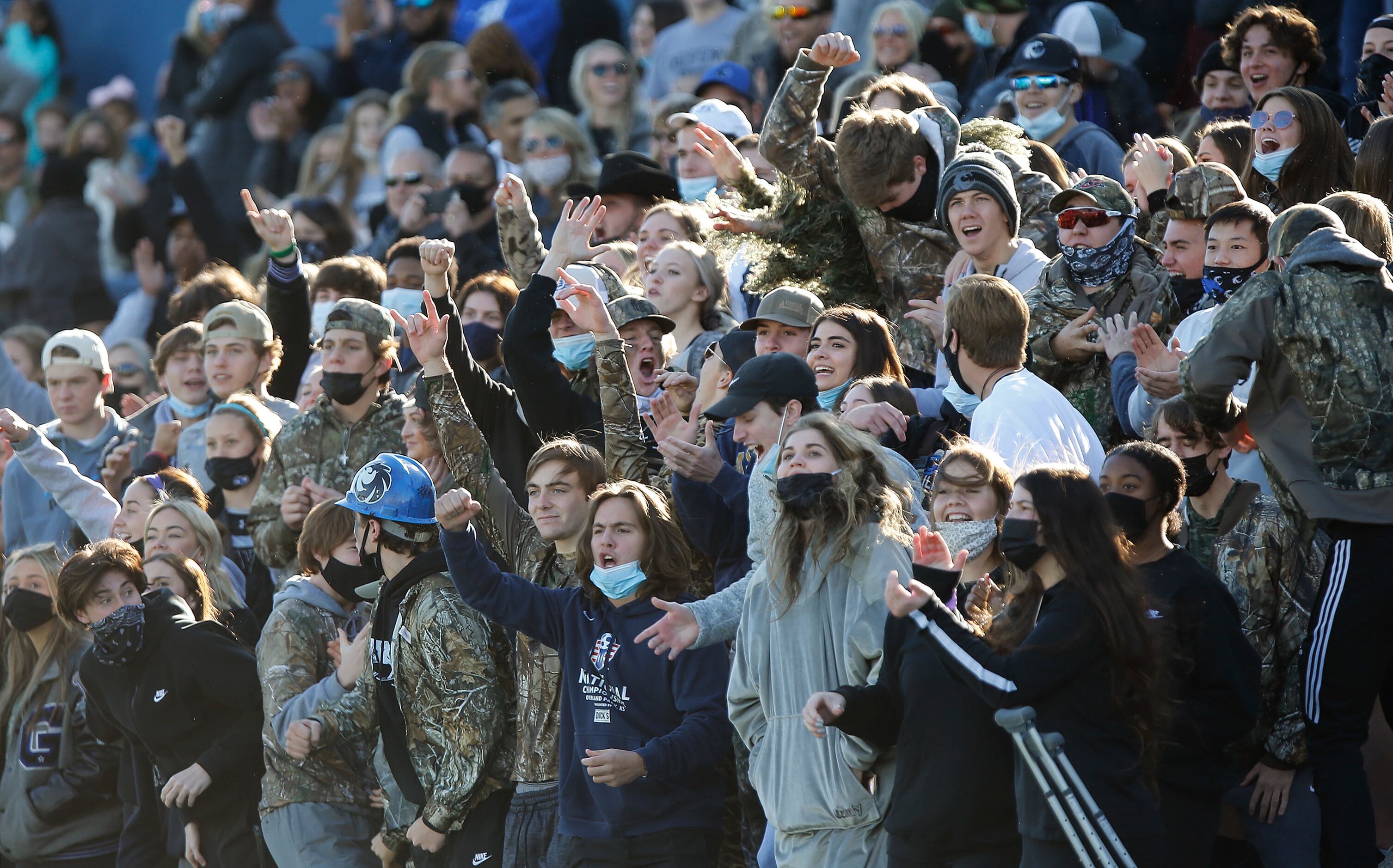 The Denton Guyer High School student section cheers a defensive stand during the second half...