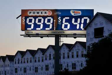 A billboard along I-30 in Dallas last summer let motorists know the Powerball lottery...
