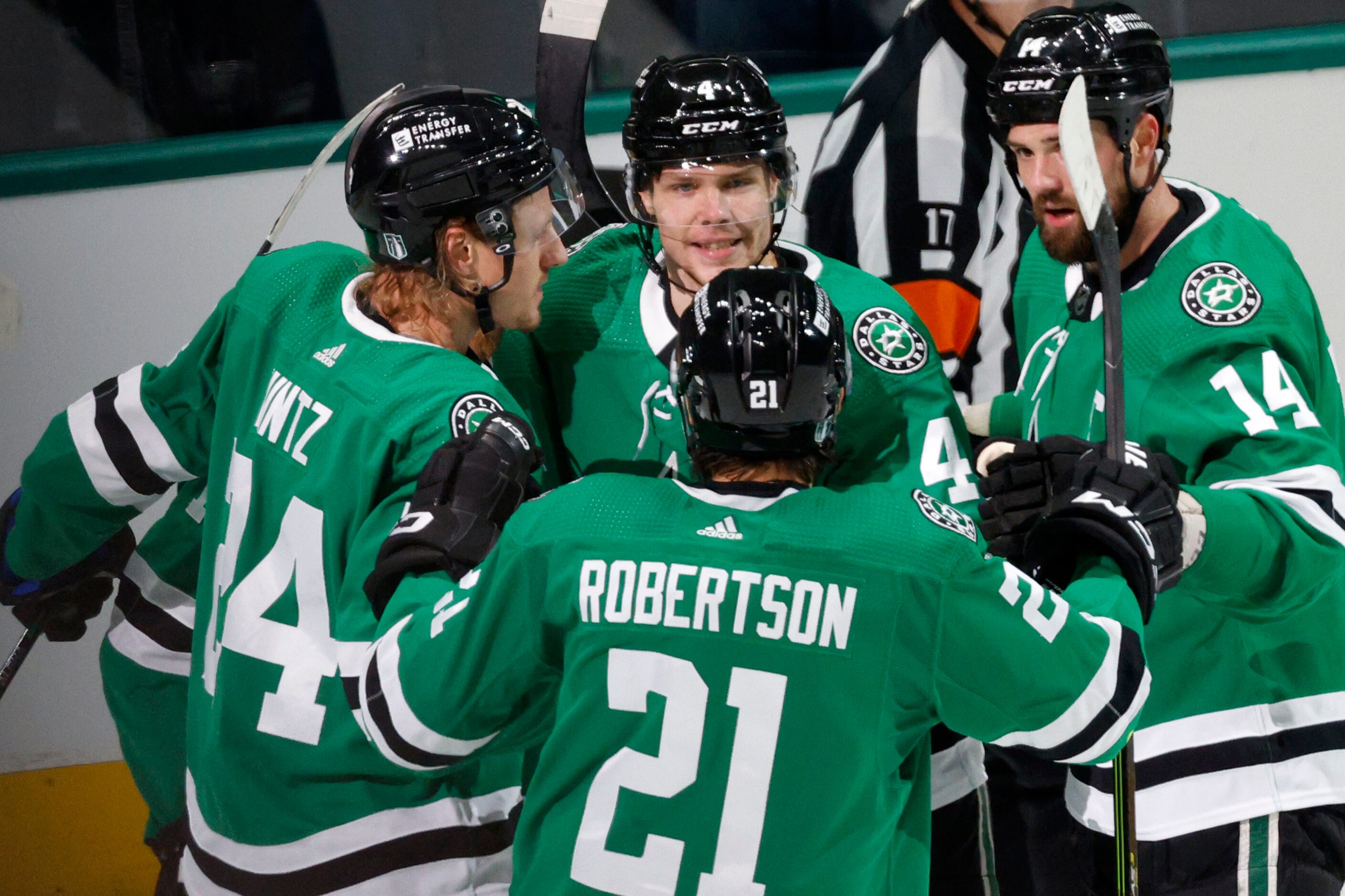 Dallas Stars defenseman Miro Heiskanen (4), center, celebrates with his teammates Dallas...