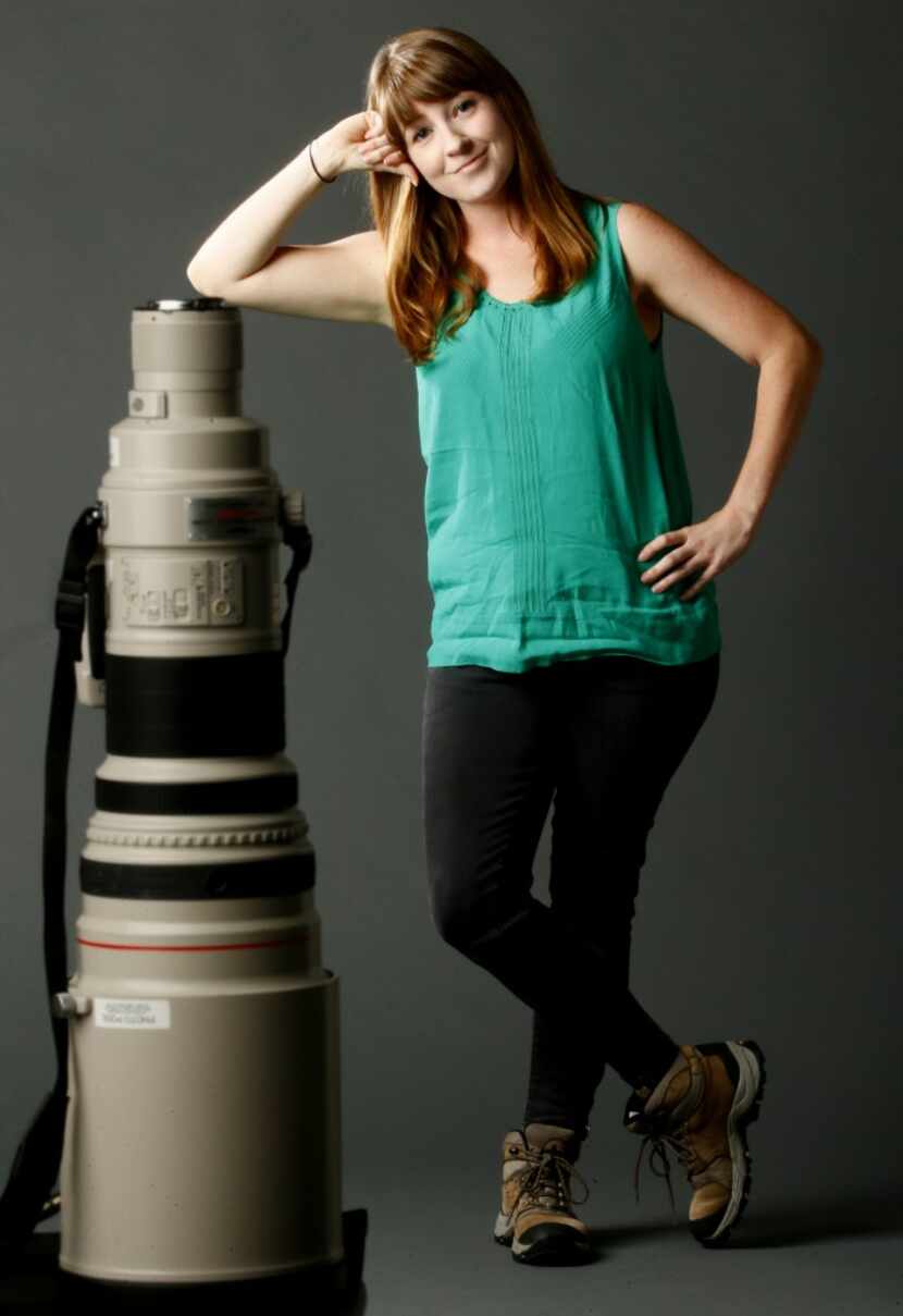  Rose Baca poses with a Canon 600mm lens. Good to note: the size of the lens is clearly a...