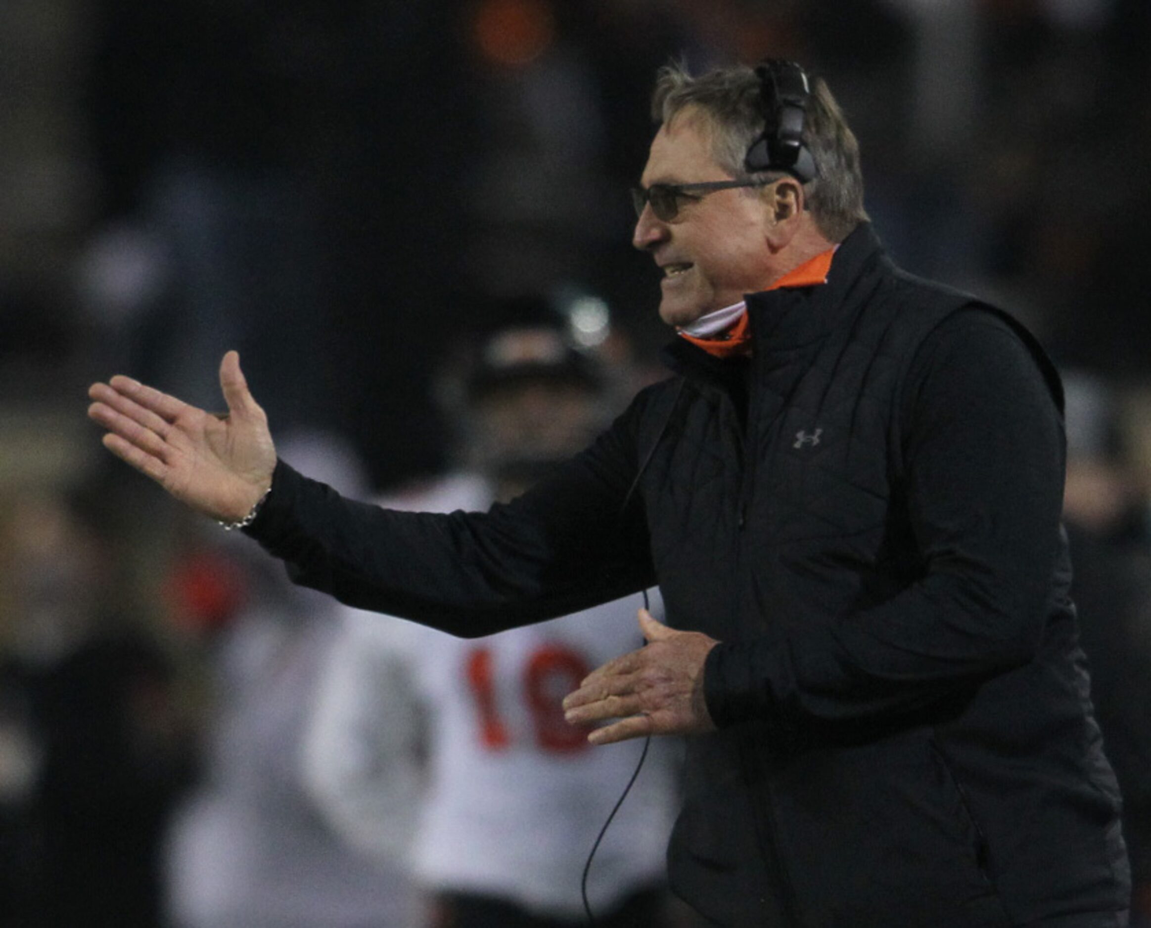 Aledo head coach Tim Buchanan delivers directions to his players from the team bench area...