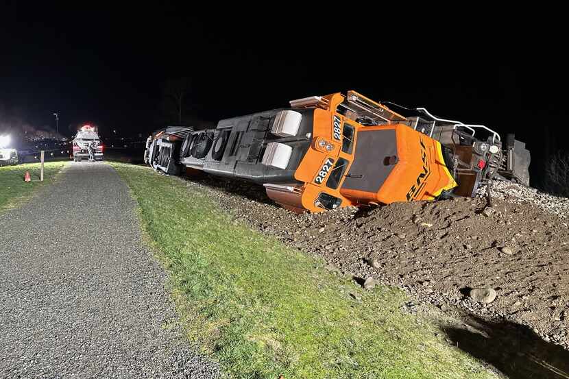 A BNSF train derailed on the Swinomish Research near Anacortes, Wash. About 5,000 gallons of...