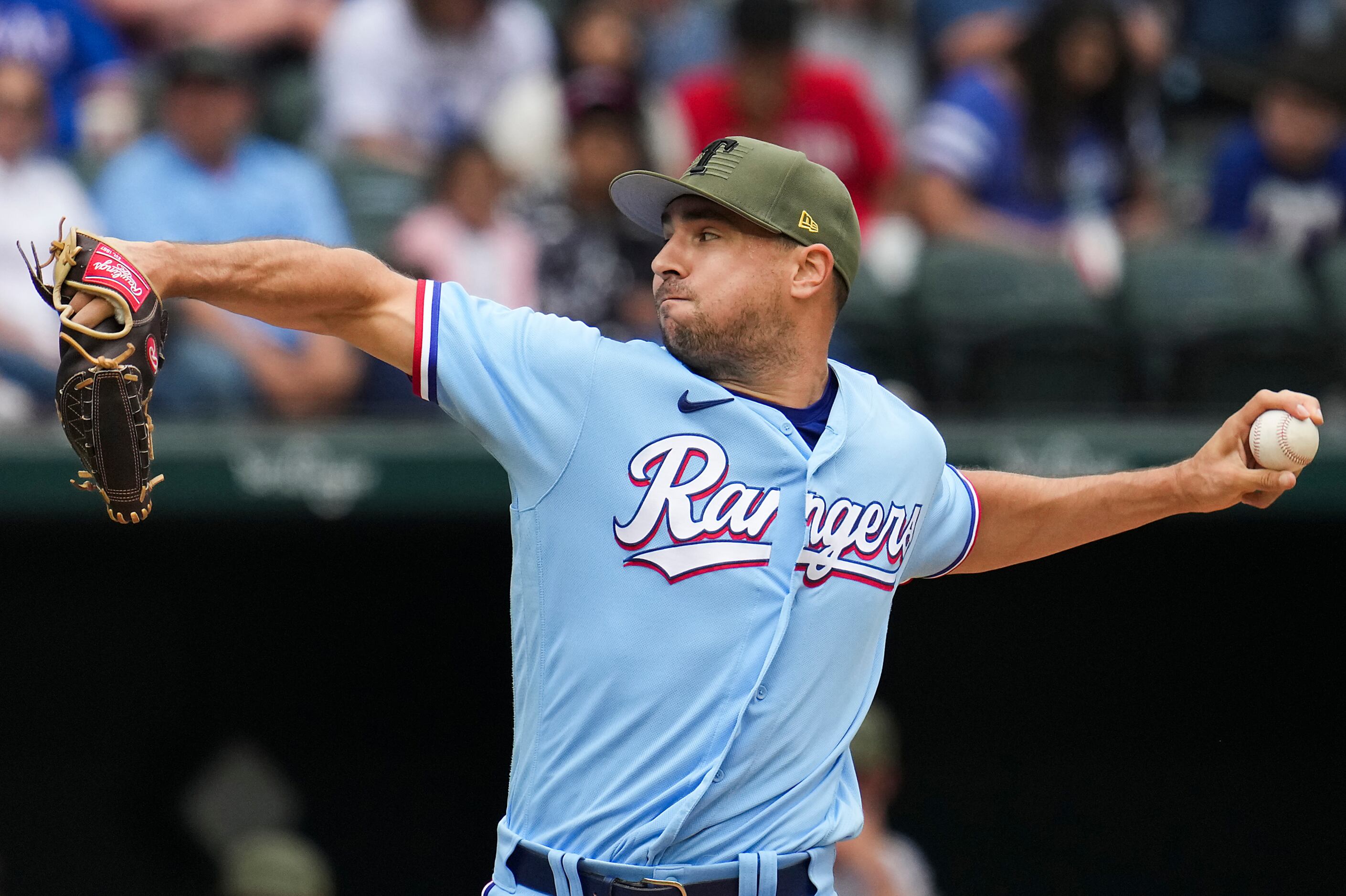 Nathaniel Lowe of the Texas Rangers points to the dugout during the News  Photo - Getty Images